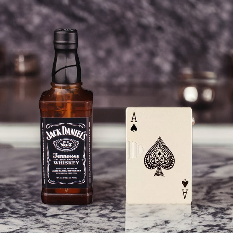 Stylish ace of spades lighter paired with a miniature Jack Daniels whiskey bottle, showcased together in a refined setting.