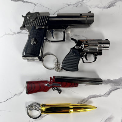 Arsenal Bundle – set of four refillable gun-inspired butane lighters including Desert Eagle, Revolver, Shotgun, and Bullet designs displayed together