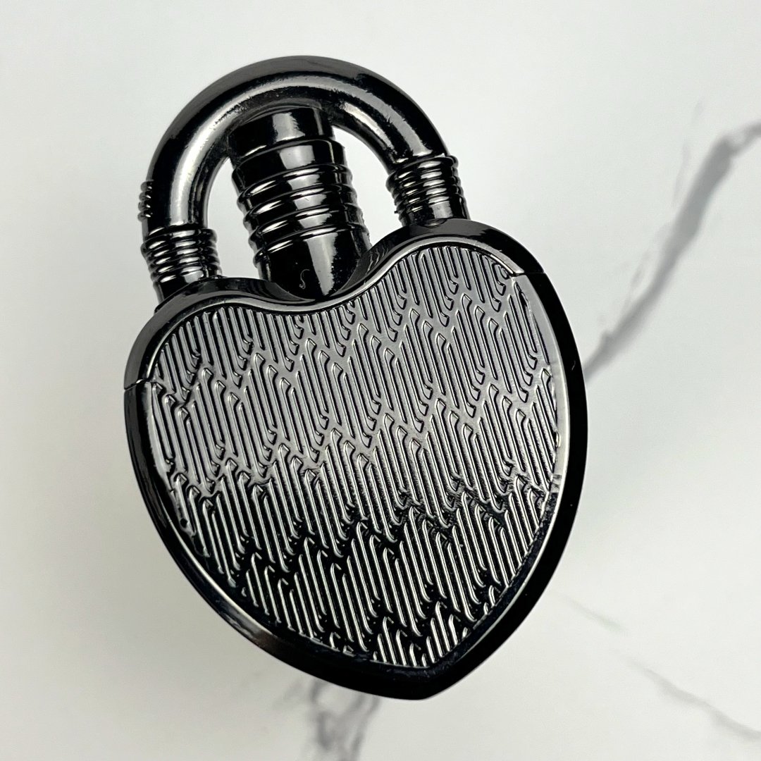 Glossy black heart-shaped lock lighter with subtle engraved lines.