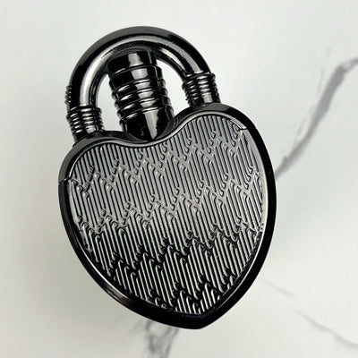 Glossy black heart-shaped lock lighter with subtle engraved lines.