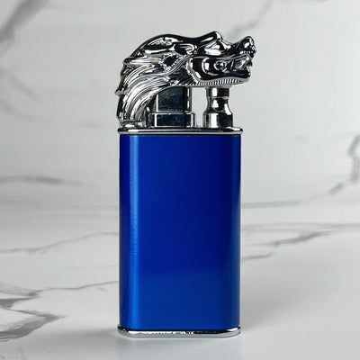 Blue torch lighter with a silver dragon head design on top.