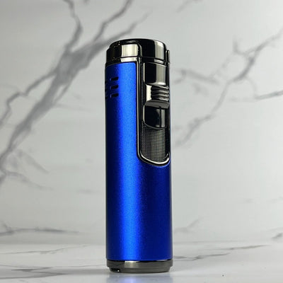 Bold blue refillable jet torch lighter with black ignition and detailed grip, displayed on marble surface.