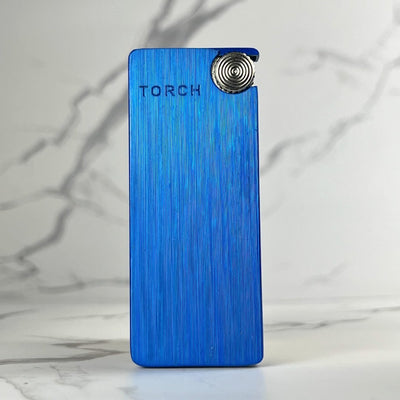 Electric blue torch lighter with minimalist design and textured vertical grain.