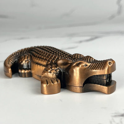 Bronze crocodile-style butane lighter designed with a realistic reptile look.