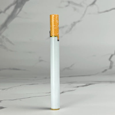 Realistic cigarette-shaped refillable lighter with white body and speckled orange tip, standing upright on a marble background.