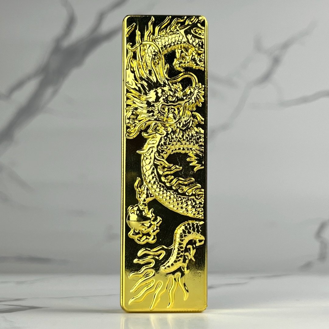Polished gold bar lighter with a bold 3D-engraved dragon motif radiating luxury and power.
