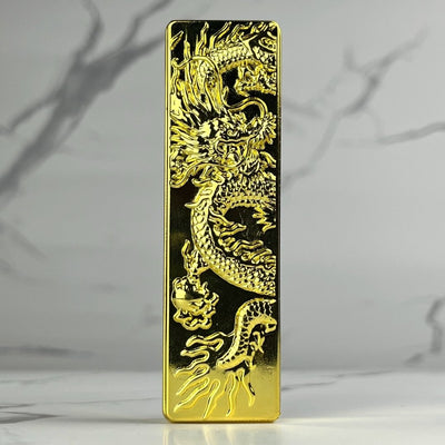 Polished gold bar lighter with a bold 3D-engraved dragon motif radiating luxury and power.
