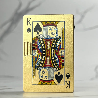 Gold playing card lighter featuring the King of Spades design.