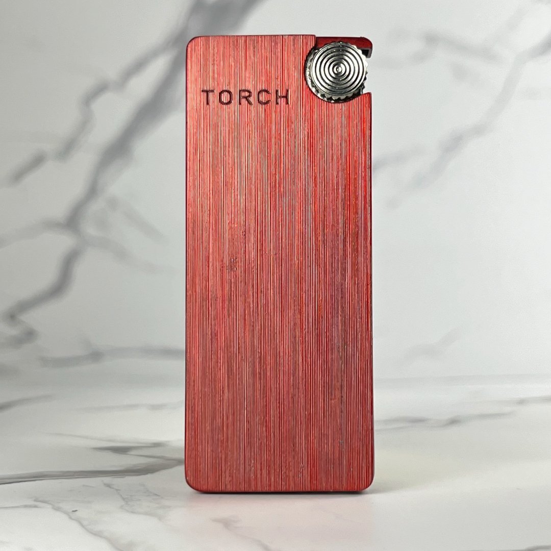 Slim red metallic torch lighter with brushed finish and silver ignition wheel.