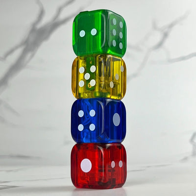 Colorful stack of four translucent dice-shaped lighters in red, blue, yellow, and green